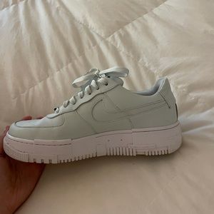 Light blue Nike Air Force 1s